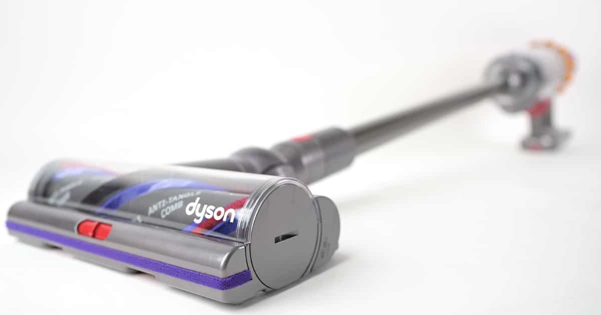 Dyson V15 Detect Cordless | Vacuum Wars Dyson V15 Detect cordless vacuum displayed on a white background, showing its Digital Motorbar cleaner head with anti-tangle brushroll.
