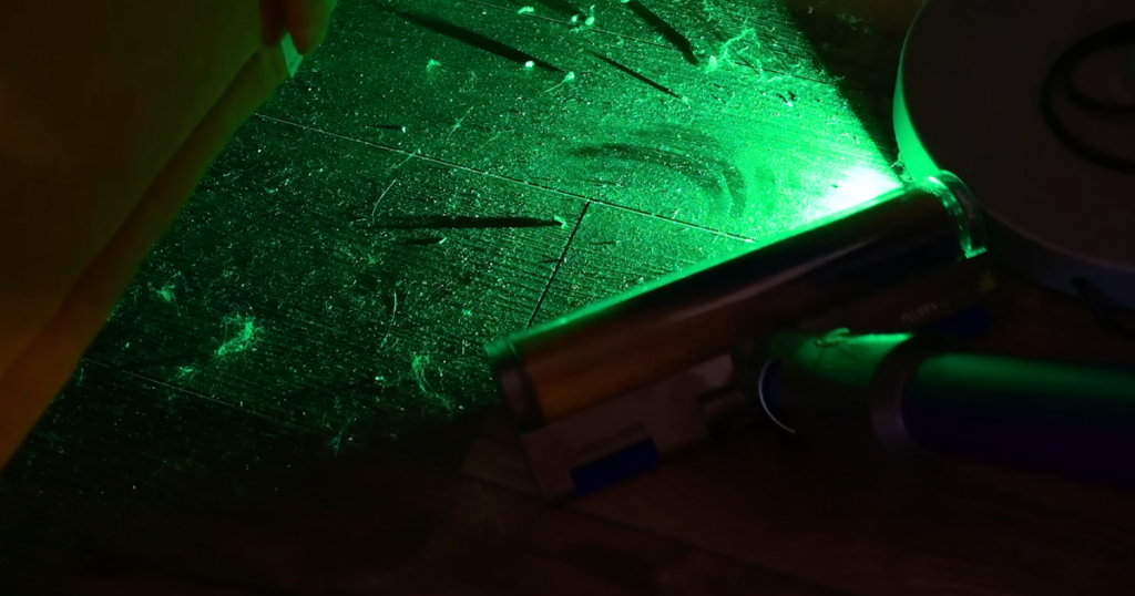 Dust Illuminated by Laser Light - Dyson Cordless Vacuum