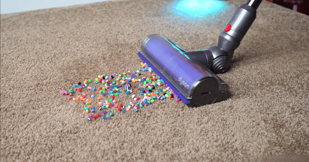 A cordless vacuum on carpet.
