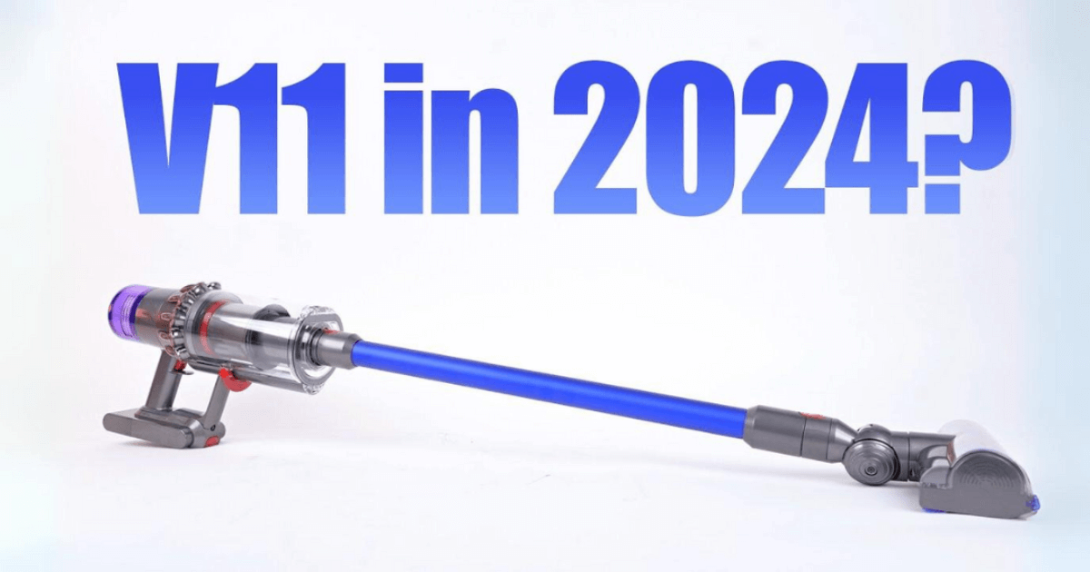 A Dyson V11 cordless vacuum with a purple and gray color scheme is positioned diagonally across the image with large blue text in the background