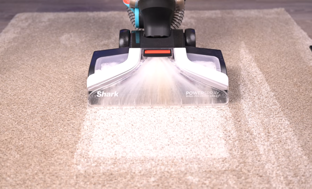 Shark EX201 carpet cleaner demonstrating its powerful suction capabilities.