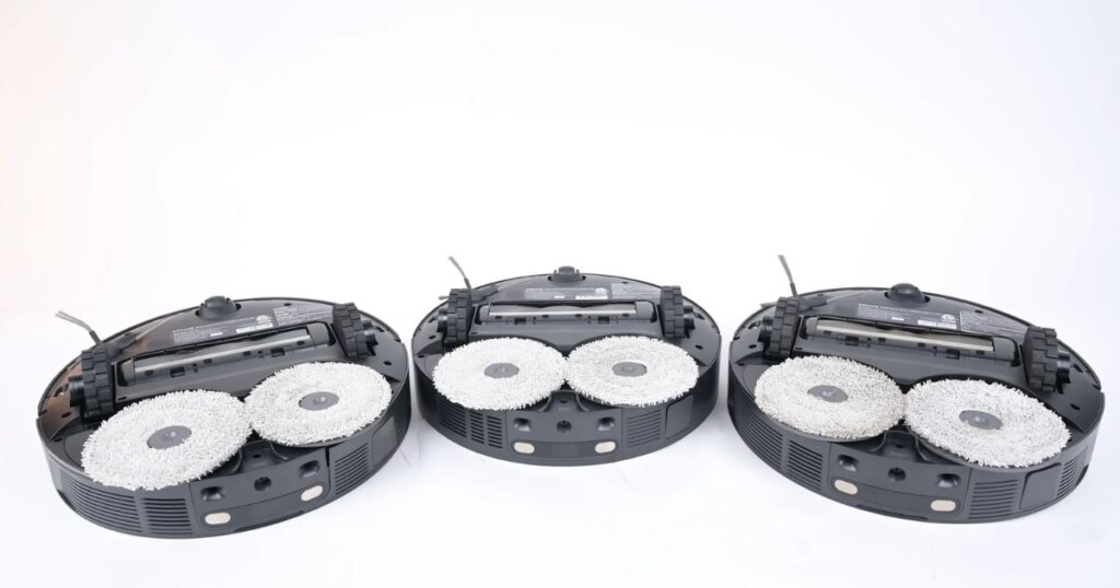 Underside view of Dreame robot vacuums showing dual spinning mop pads and brush roll layout on the L20, L30, and X30 Ultra.