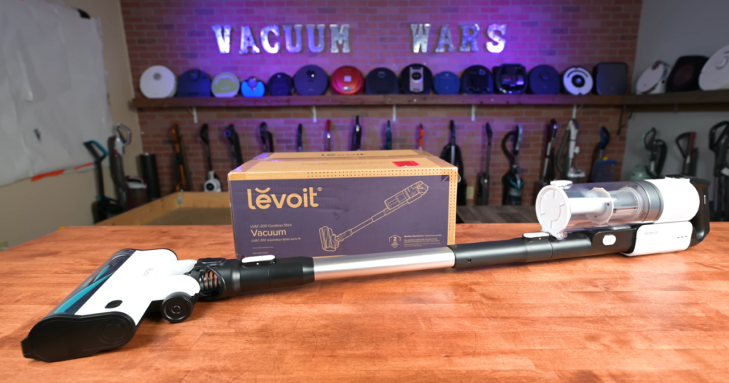 | Vacuum Wars Levoit LVAC-200 cordless vacuum displayed on a table with its product box in the background