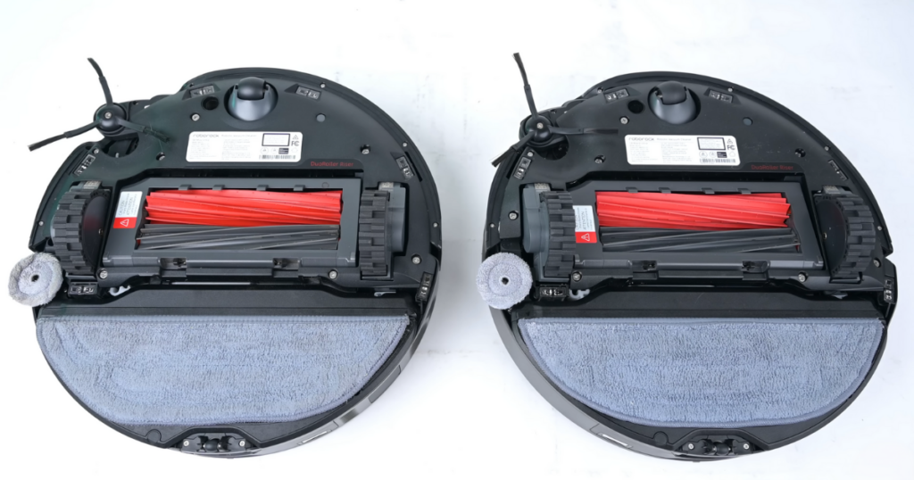 Bottom view of two Roborock robot vacuums, the S8 Max Ultra (left) and S8 MaxV Ultra (right). Both vacuums show their cleaning mechanisms, including red rubber brush rollers, side brushes, and attached mop pads. The robots are placed side by side on a white background.