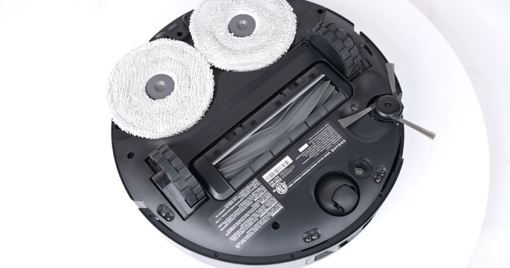 Bottom view of the Dreame X40 Ultra robot vacuum, showing its brushes, mop pads, and wheels.