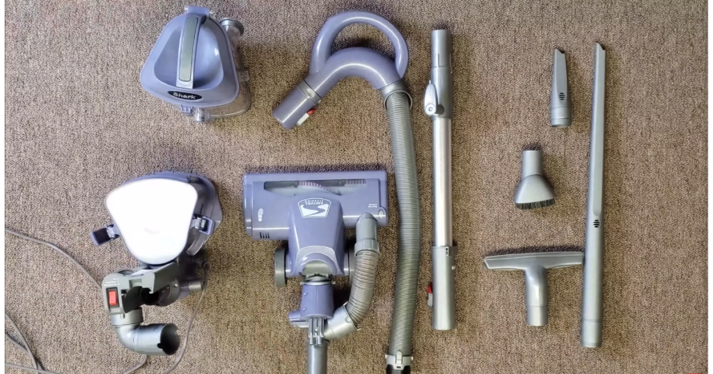Various parts of a Shark Navigator upright vacuum.