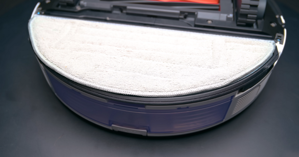 A close-up view of the mop pad attached to the bottom of the Roborock S8+ robot vacuum, showing the pad securely in place.