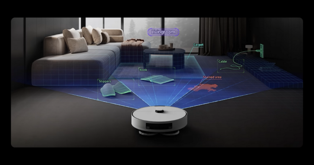 A Samsung Bespoke Jet Bot AI Combo robot vacuum using advanced sensors to map a living room, identifying obstacles such as slippers, a book, a cable, a carpet, and a stained area on the floor.