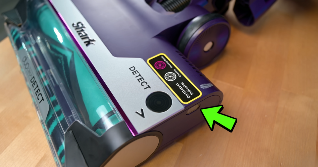 Close-up of the Shark PowerDetect vacuum's Edge Detect sensor located near the DuoClean roller system. A green arrow points to the Edge Detect sensor, highlighted with a yellow label.