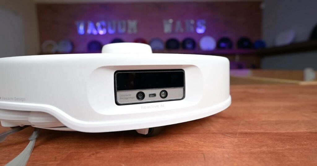 Close-up of the Roborock QRevo Curv’s front-mounted Reactive AI camera and obstacle recognition system.