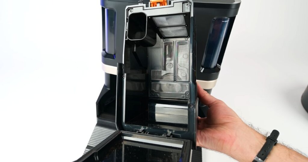 Close-up of the Shark NeverTouch Pro’s bagless bin system, showing its internal components and design.