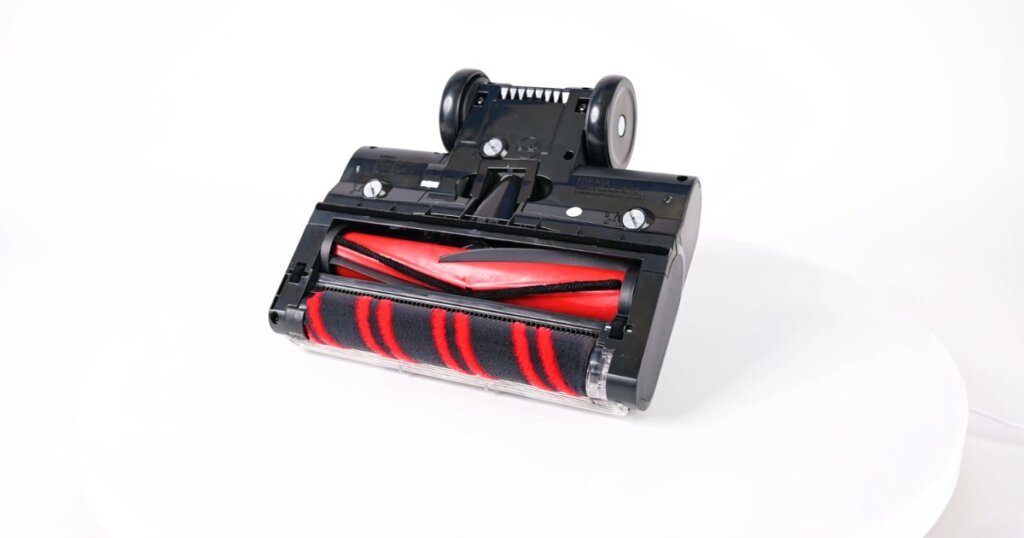 Underside of a Shark Duo Clean vacuum head featuring both a soft roller and a traditional bristle brush.