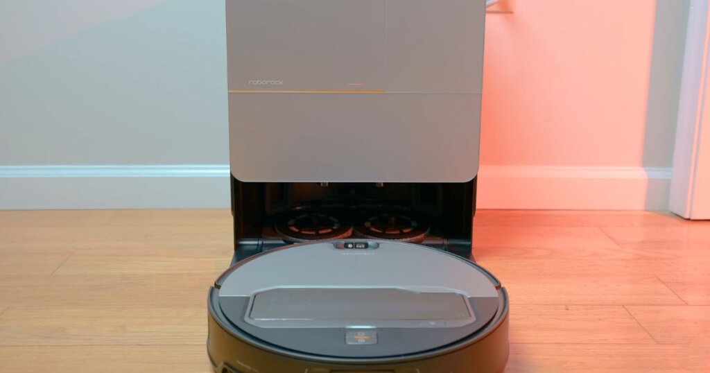 Roborock Saros Z70 docked with mops removed and left behind at the base station to avoid carpet wetting.