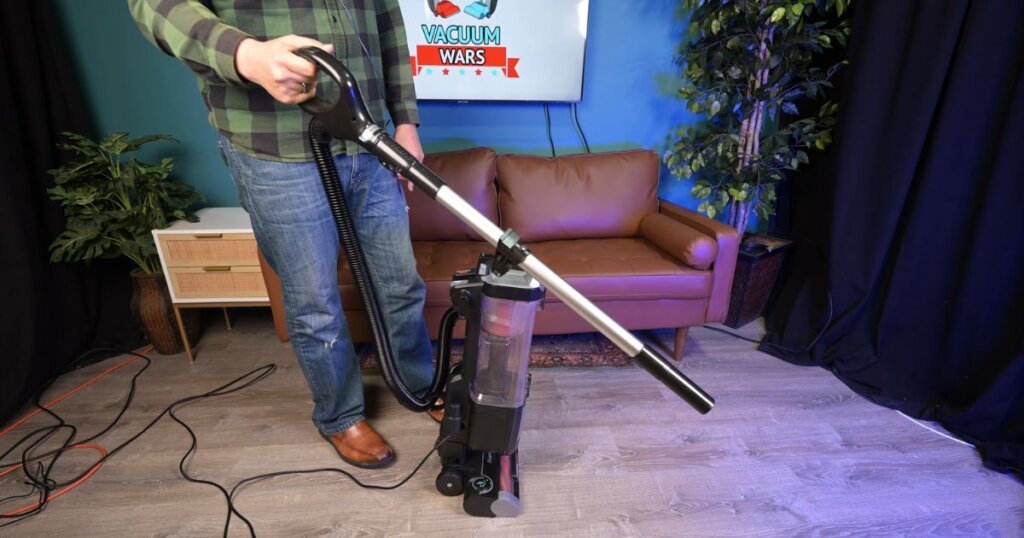Person holding the detachable wand feature on the Shark Rotator Pet ZU102 vacuum.