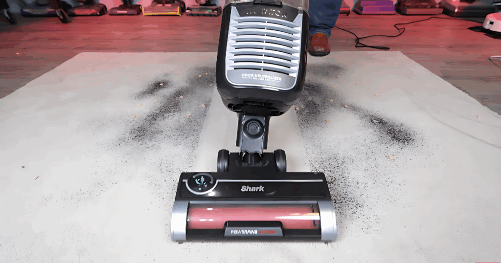 Shark Rotator Pet vacuuming up debris in the Vacuum Wars Studio.