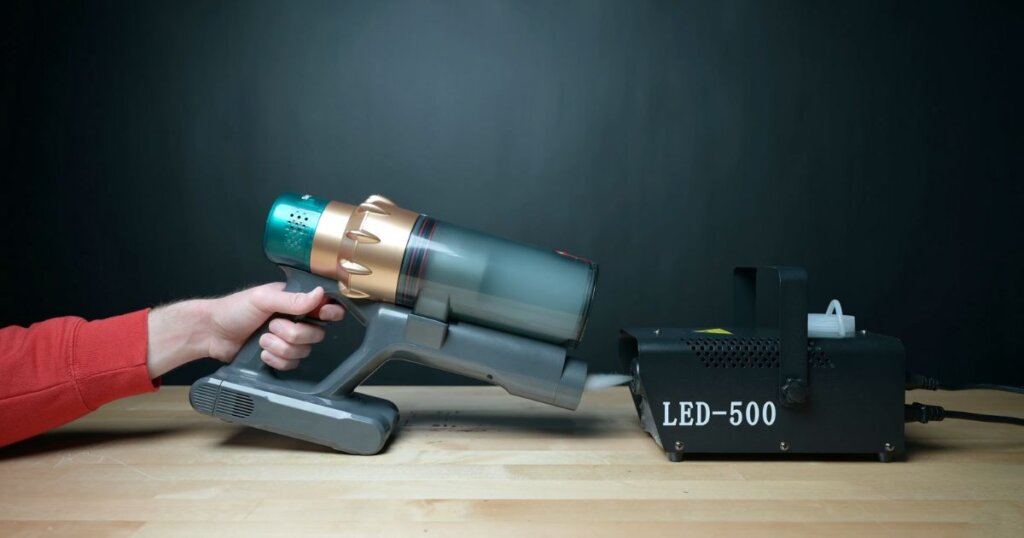 Smoture VAC01 being tested with a fog machine to evaluate filter seal quality.