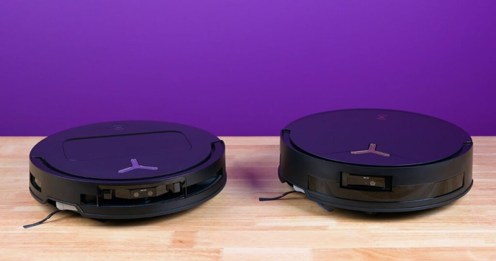 Side-by-side image of the T50 Max Pro Omni and T50 Pro Omni robot vacuums on a wooden surface, showing slight height differences against a purple background.