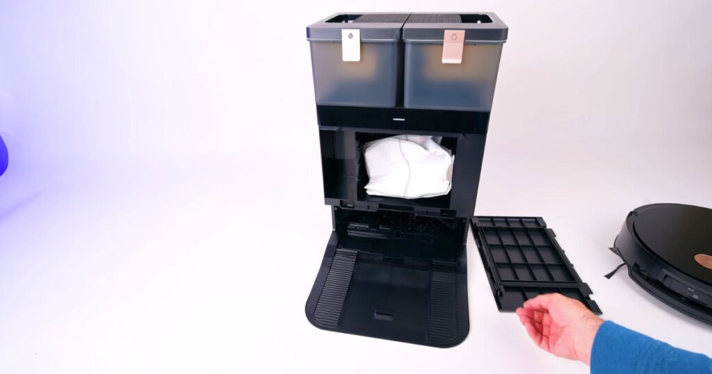 Close-up of Yeedi S14 Plus dock with dustbin and water tanks exposed for cleaning and maintenance.