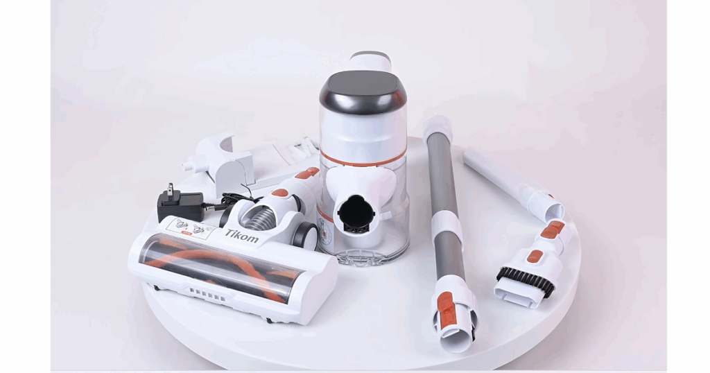 All included Tikom V500 attachments displayed: motor, power brush head, wand, wall mount, charger, and two accessory tools.