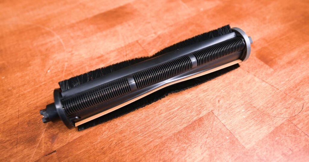 Close-up view of a vacuum roller brush designed for active hair removal, used in the MOVA P50 Pro Ultra.