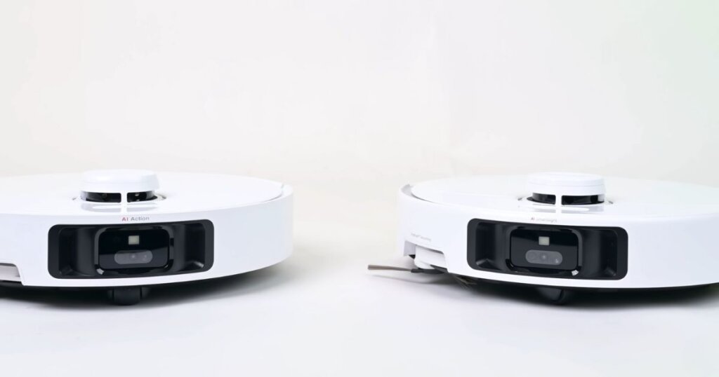Close-up front view of two white MOVA robot vacuums side by side (P50 Pro Ultra and P10 Pro Ultra), showing their camera-based obstacle sensors.