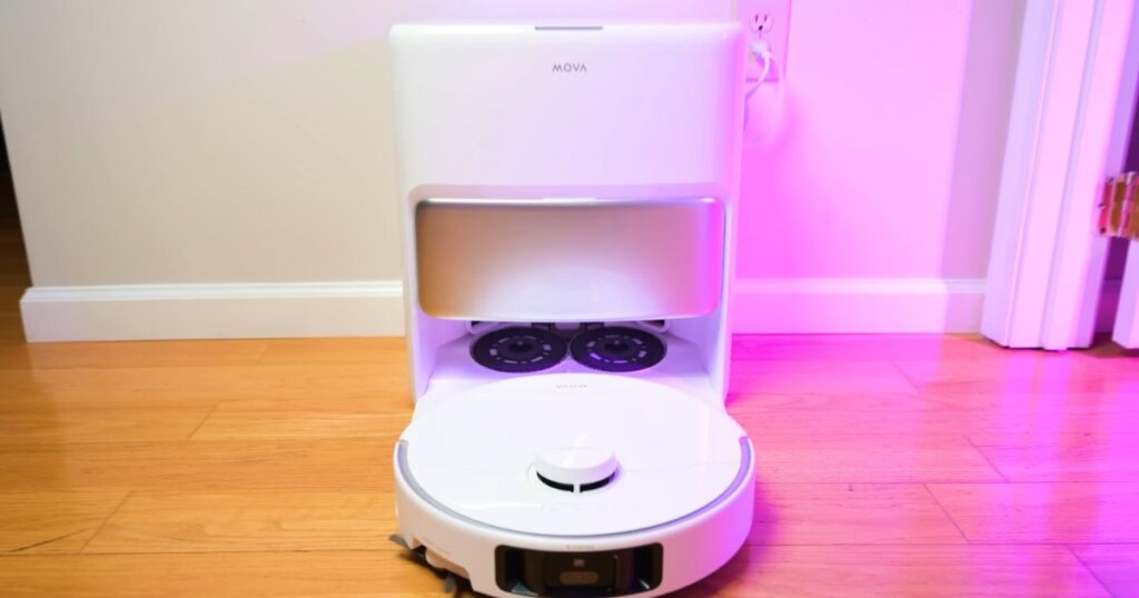 Front view of the MOVA P50 Pro Ultra dock with the robot leaving its spinning mop pads behind.