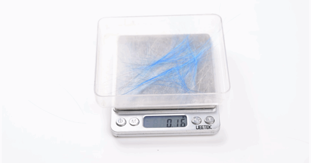 Weighing the hair collected in our pet hair pickup test.  The Xiaomi X20 Max had an almost precisely average pet hair pickup on carpet of 81.5% hair removed