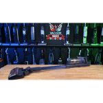 Bissell PowerClean DualBrush 4196K in studio 150 ©Vacuum Wars | Vacuum Wars Wooden workbench with a hand saw laid in front of blue to green bottles on shelves behind.
