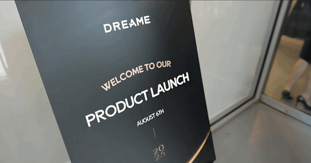 Signage Reading, "Dreame: Welcome to our Product Launch August 6, 2025"