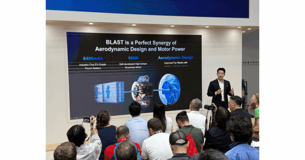 Ecovacs presentation at IFA 2025 showing a slide on BLAST technology, highlighting a 6400 mAh EV-grade pouch battery, 100W high-torque brushless motor, and aerodynamic fan blade design.