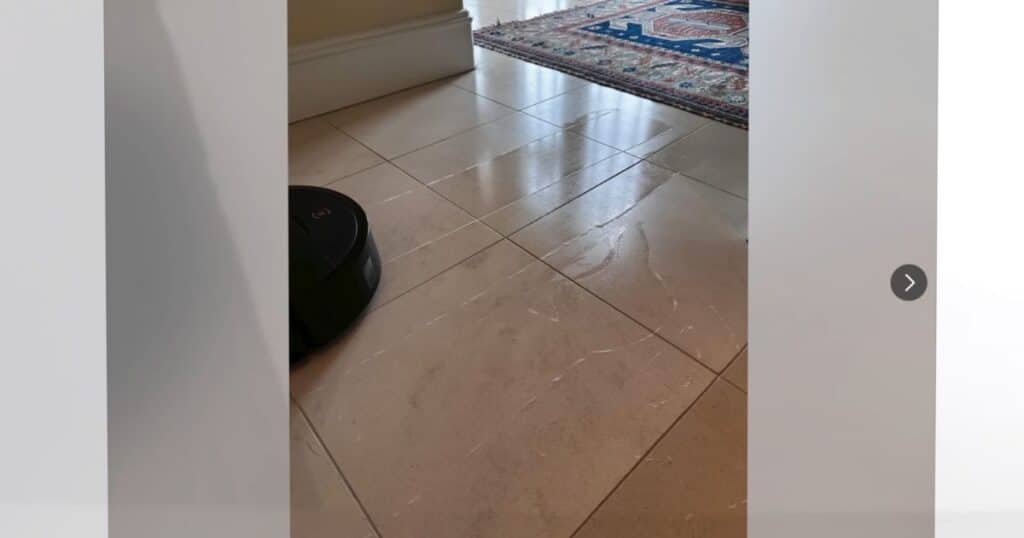 Tile floor with excessive water and streaking left behind after the Ecovacs X9 Omni mopped.