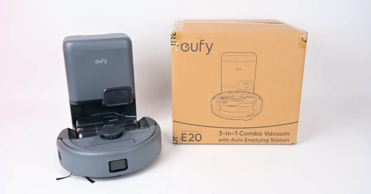 Eufy E20 3-in-1 robot vacuum and auto-empty base shown alongside retail packaging box.