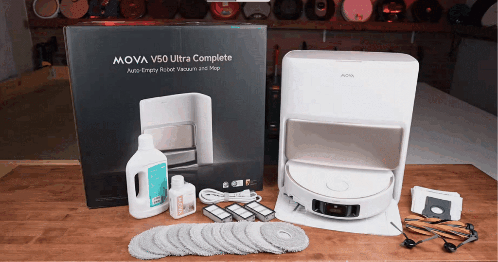 MOVA V50 Ultra Complete robot vacuum and mop combo in white, shown alongside its accessory kit including extra mop pads, HEPA filters, and disposable dust bags.