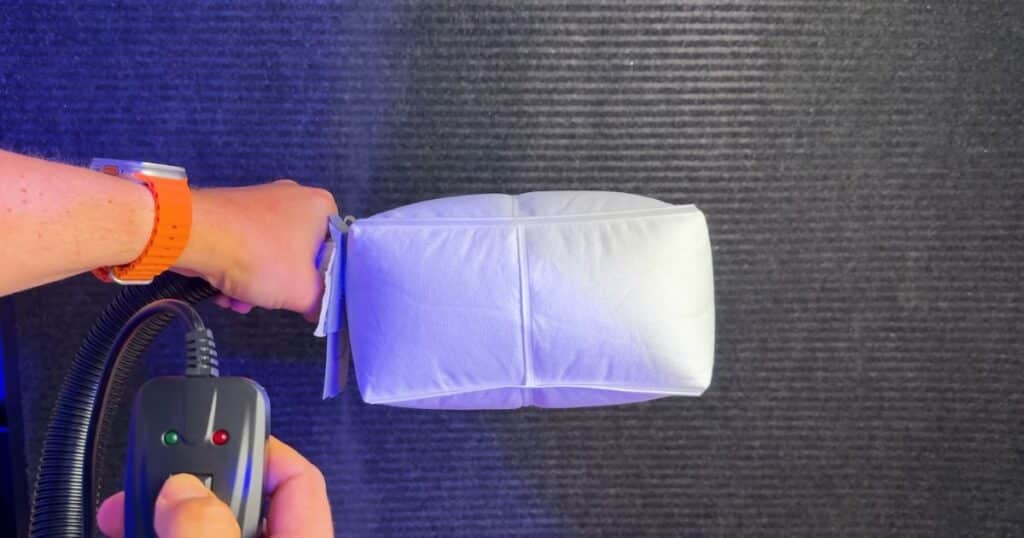 Roborock official vacuum bag inflated during fog test, showing minimal leakage compared to third-party bags.