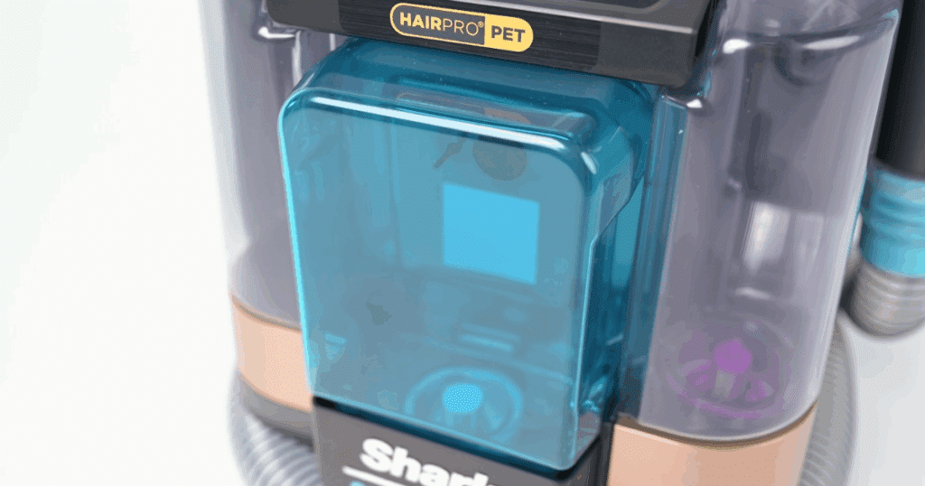 Shark Stain Striker spot cleaner featured in the 2025 Vacuum Wars competition, noted for top-tier stain reduction performance, aided by a dedicated concentrated oxy solution tank.