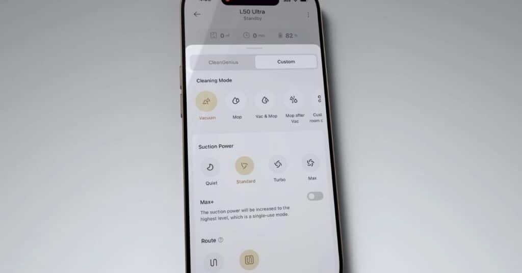 Smartphone screen showing Dreame L50 Ultra app controls with cleaning modes (Vacuum, Mop, Vac & Mop, Mop after Vac, Custom), suction power levels (Quiet, Standard, Turbo, Max), and a Max+ option toggle.