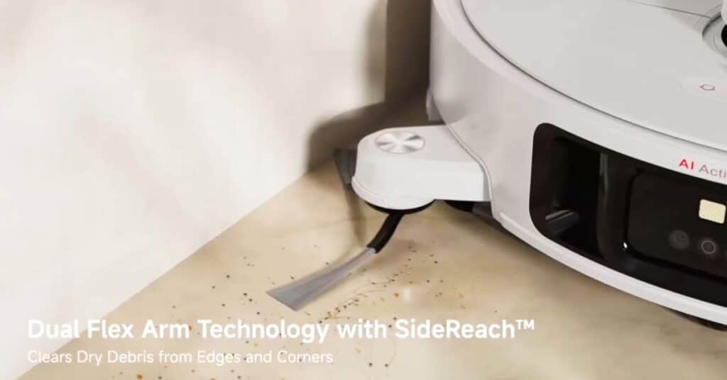 White Dreame L50 Ultra robot vacuum showing extending side brush sweeping debris from wall edges and corners.