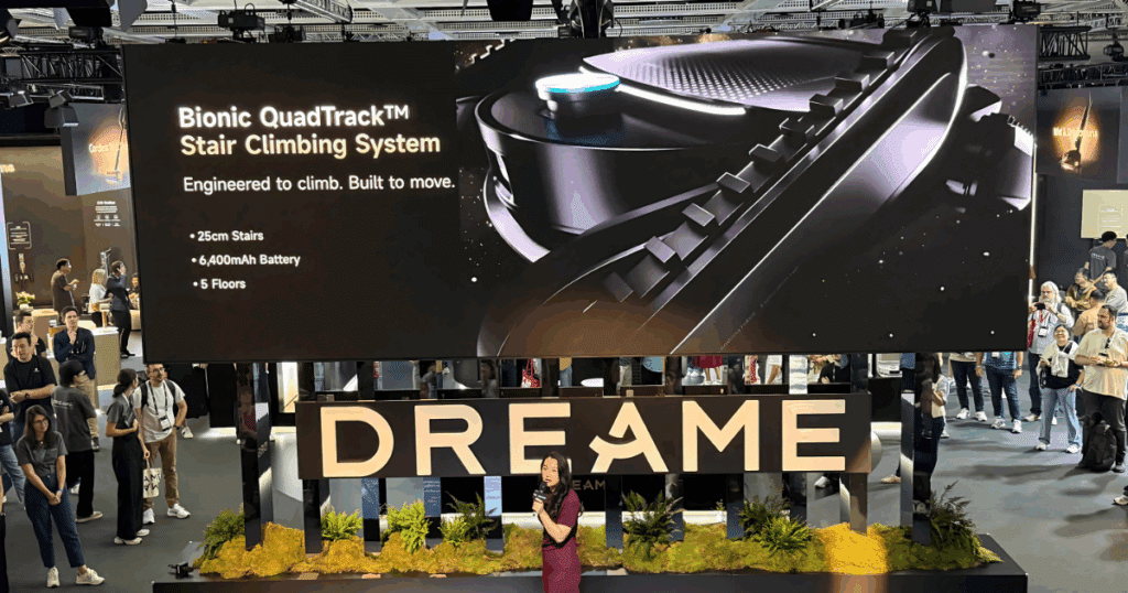 Dreame explains the CyberX QuadTrak stair-climbing system to Vacuum Wars and other attendees at IFA 2025. 