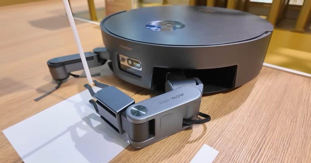 MOVA Sirius 60 robot vacuum with two robotic arms attached at the front, on display at IFA 2025.