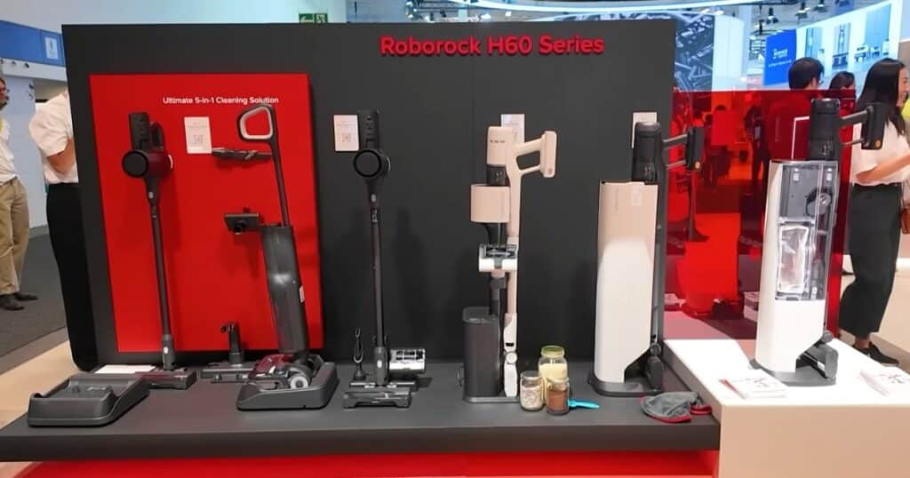 Roborock H60 Ultra cordless stick vacuum series lineup displayed with docking stations and accessories at IFA 2025.