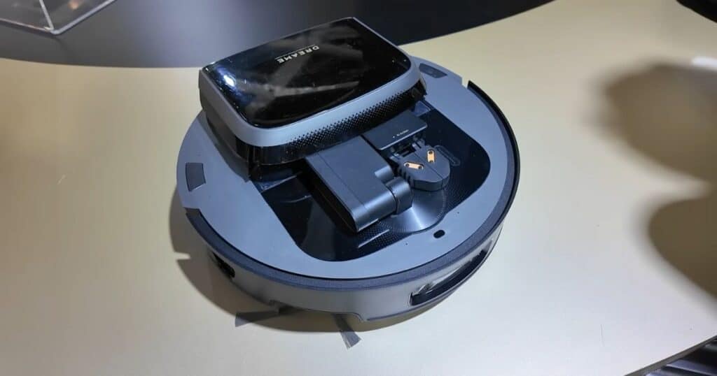 Dreame Cyber10 Ultra robot vacuum at IFA 2025 showing its extended robotic arm attachment on top.