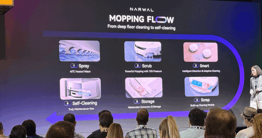 A Narwal representative explains various features of the Flow to attendees at IFA 2025. 