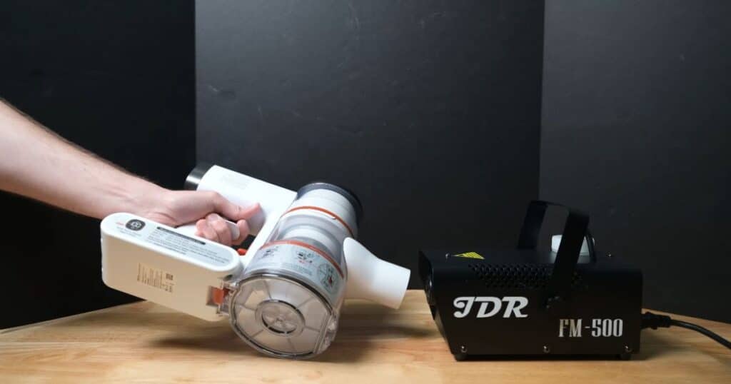 Tikom V500 cordless vacuum filtration test results showing minor visible fog but overall the best filtration performance observed in its under-$100 price range.