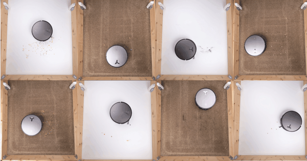 Ecovacs Deebot X11 review: Ecovacs Deebot X11 OmniCyclone robot vacuum cleaning test on hard floor and carpet, removing cereal and coffee grounds during Vacuum Wars surface debris tests