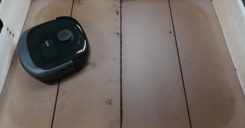 Eufy Omni E25 robot vacuum performing a crevice pickup test where it scored 2 out of 4