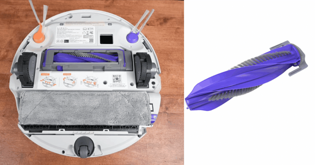 Underside of the Narwal Flow in the Vacuum Wars studio, showing a belt-style continuous clean roller mop and a floating anti-tangle brush