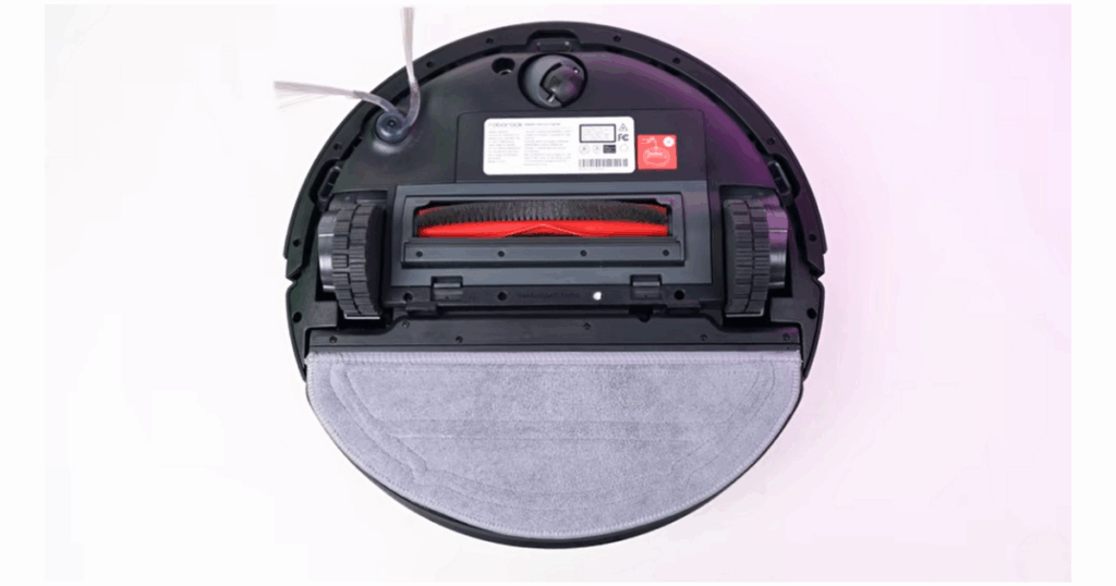 Bottom view of the Roborock Q10 S5+ robot vacuum showing its VibraRise 2.0 vibrating mop pad, which automatically lifts 8 mm when detecting carpet to prevent moisture on rugs.