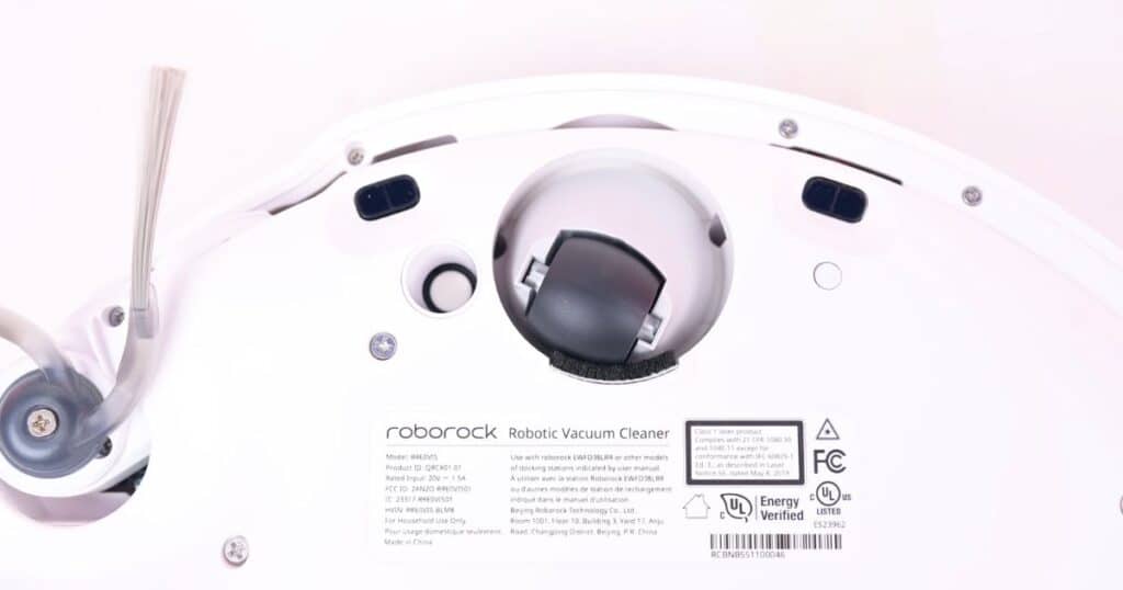 Bottom view of Roborock Qrevo CurvX robot vacuum showing its adaptive lift chassis and wheel assembly.