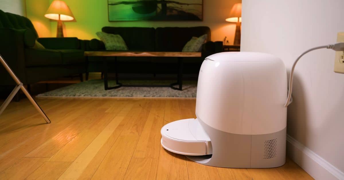 The Roborock Qrevo CurvX  robot vacuum in its automated docking station in our home.