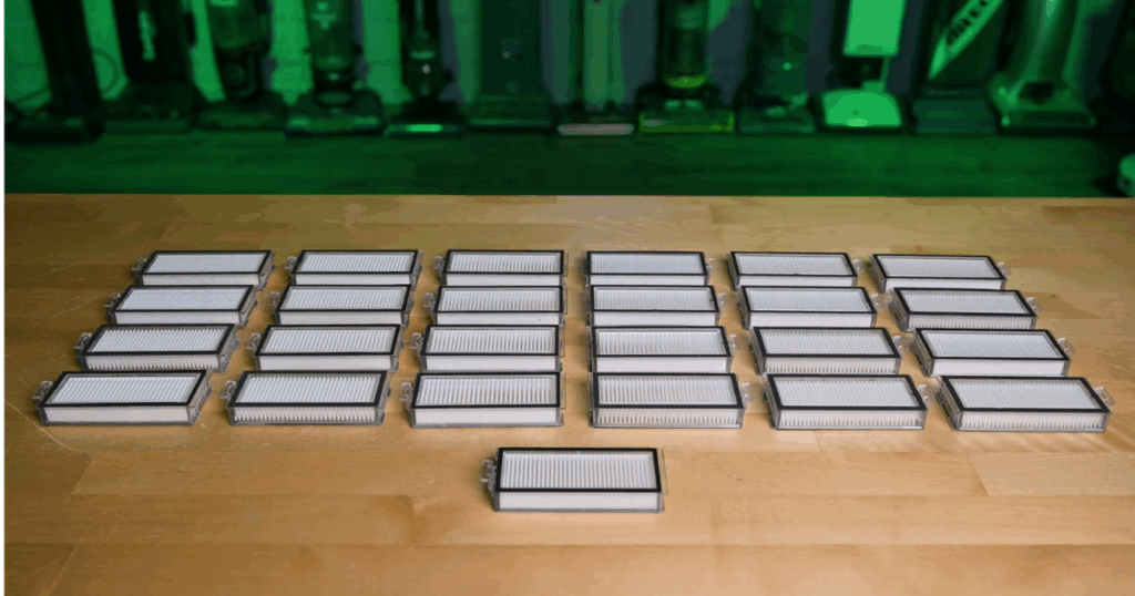 Roborock cartridge filters, which should be replaced every few month to prevent issues with airflow or suction, on a table in the Vacuum Wars studio